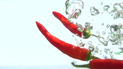 Red pepper in water. Slow motion 스톡 동영상 56744076
