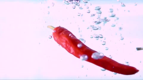 Red pepper in water. Slow motion Stock Footage 56744077