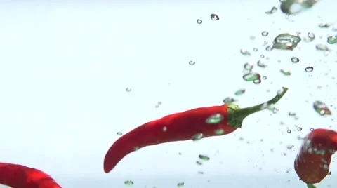 Red pepper in water. Slow motion 240 fps. Video stock 56744091