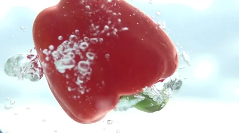 Red pepper in water. Slow motion 240 fps. Stockbeeldmateriaal 56768446