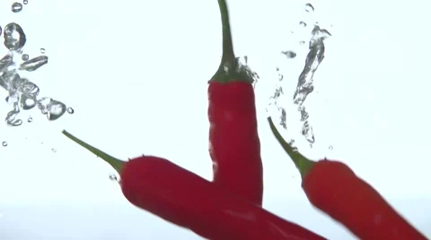 Red pepper in water. Slow motion 240 fps. Stock Footage 56768557