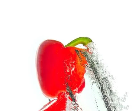 Red pepper in water splash Stock Photos