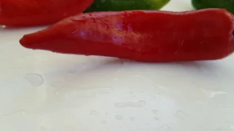Red pepper wet on white background spinning Stock Footage 88292840