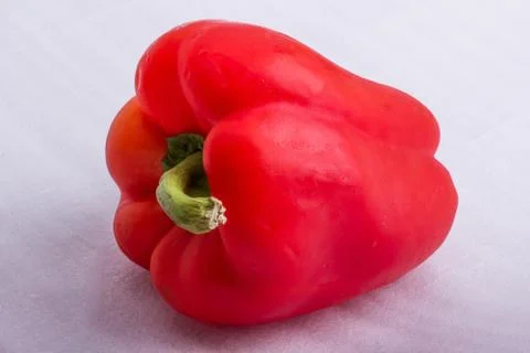 A red pepper on a white surface Stock Photos