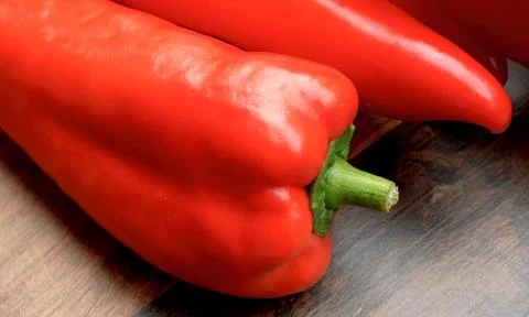 Red pepper on wood background Stock Photos