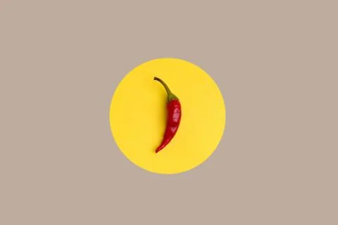 Red pepper on a yellow background Stock Photos