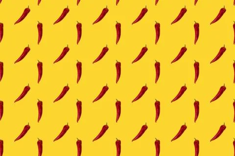 Red pepper on yellow seamless pattern. Stock Photos