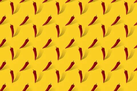 Red pepper on yellow seamless pattern. Fotos de archivo
