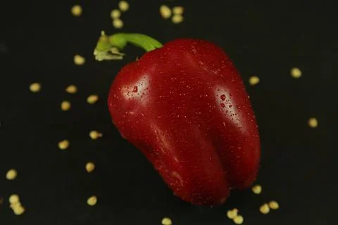 Red peppers on black background Stockfoto's