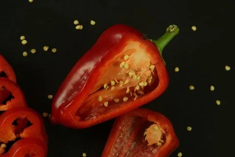 Red peppers on black background Stockfoto's