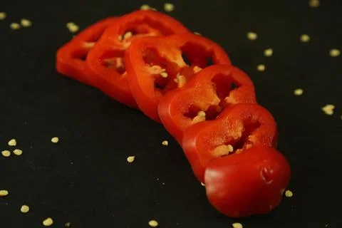 Red peppers on black background Stock Photos