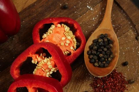 Red peppers on black background Stock Photos