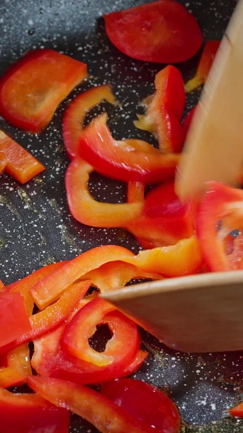 Red peppers cooked, Bright red peppers become glossy and fragrant Stock Footage 329278759