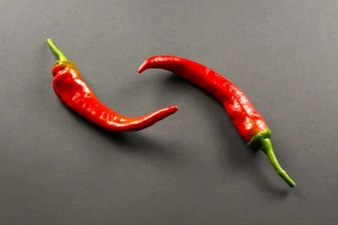 Red peppers on a dark background Stock Photos