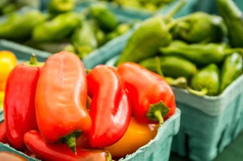 Red peppers on display in boxes Stock Photos