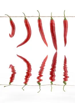 Red peppers hanging on a string Stock Photos