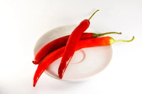 Red peppers on a plate Stock Photos