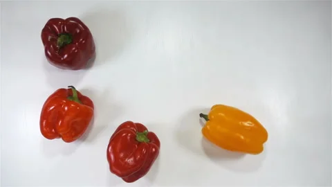 Red peppers in slow motion on white Stock Footage 139387040