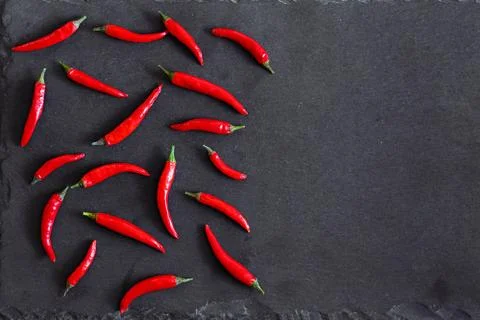 Red peppers on stone background Stock Photos