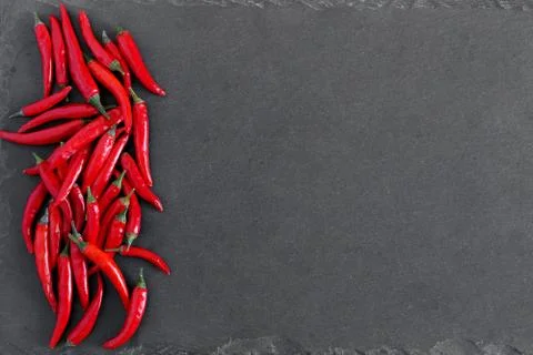 Red peppers on stone background Stock Photos