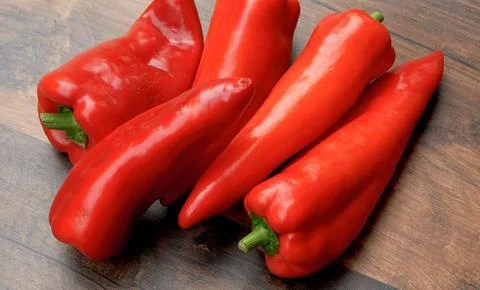 Red peppers on the table Stock Photos