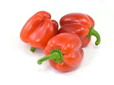 Red peppers on white Stock Photos