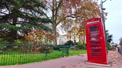 Red Phone Booth Book Exchange in Square du Val d’Osne Paris Video stock 323907977
