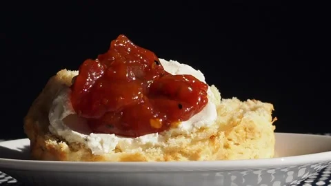 Red Pickled Chutney Being Added To A Cheese Scone Scone, UK Stock Footage 221644019