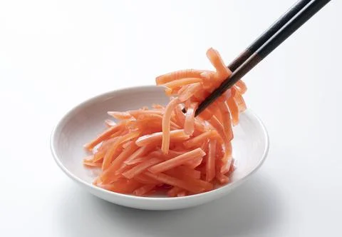 Red pickled ginger on a white background Stock Photos