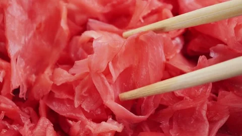 Red pickled ginger is widely used as a spice in Asian cuisine. Stock Footage 330109823