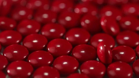 Red pill on the turntable Stock Footage 249973639