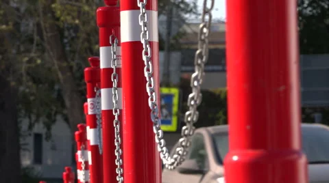 The red pillars connected by a chain. Parking. Video stock 55273058