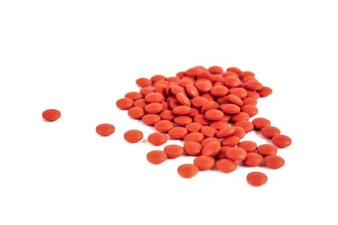 Red pills on a white background, isolate. Stock Photos