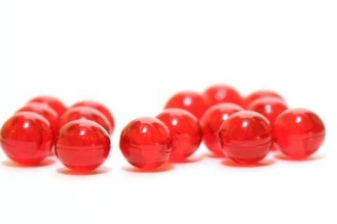 Red pills on white background Stock Photos