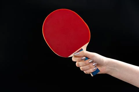 Red ping pong racket on dark background Stock Photos