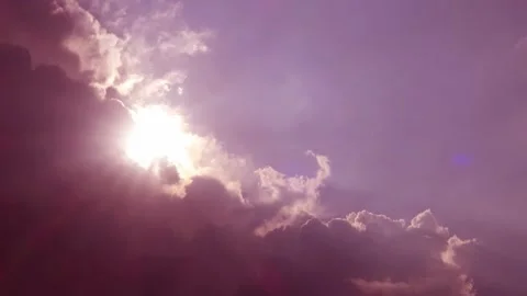 Red pink cloud n bright sun light ray on purple blue sky Video stock 183306518
