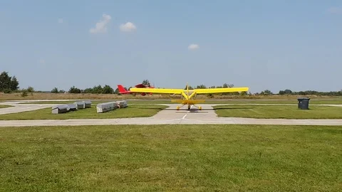 Red plane with a propeller sits down and takes off at the airport 스톡 동영상 109547708