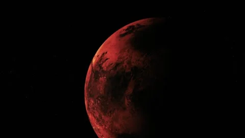 A red planet in deep black space, partly lit with a dark shadow on one side Stock Footage 340389340