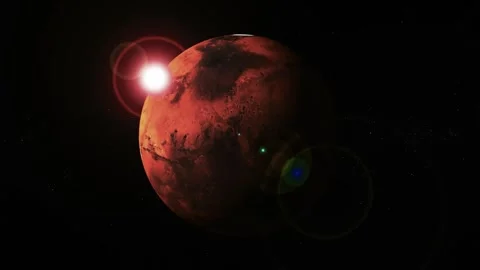 Red planet lit by a bright sun flare against a dark space background, showi.. Stock Footage 340383308