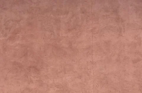 Red plastered wall. Texture with plaster stains Stock Photos