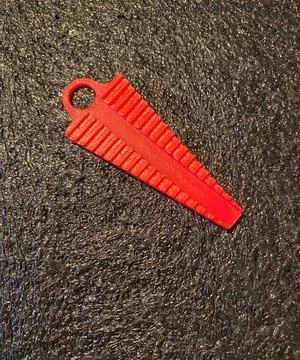 Red plastic 3D printed bending jig tool for shaping electronic component lead Stock Photos