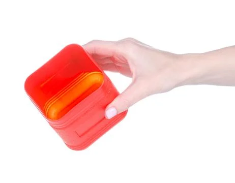 Red plastic box container in hand Stock Photos