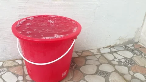 Red Plastic Bucket Filled with Soapy Water Stock-Footage 329418246