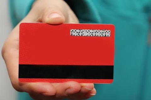 Red plastic card in hand Stock Photos