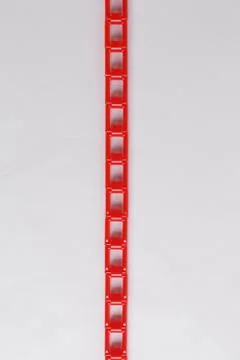 Red plastic chain on a white background Stock Photos