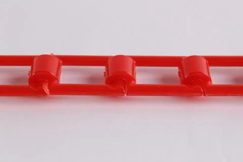 Red plastic chain on a white background Stock Photos