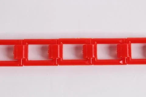 Red plastic chain on a white background Stockfoto's