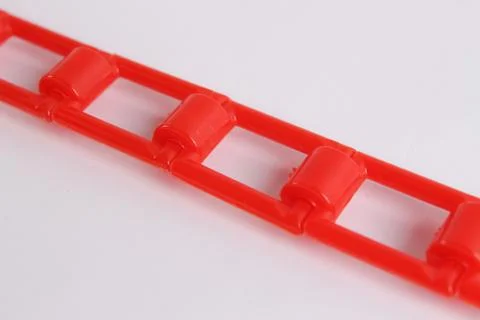 Red plastic chain on a white background Stock Photos