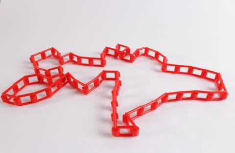 Red plastic chain on a white background Stock Photos