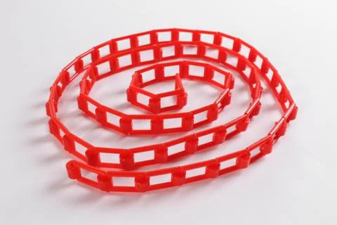 Red plastic chain on a white background Stockfoto's